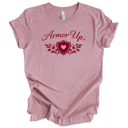Pink t-shirt with 'Armor Up' design on a white background